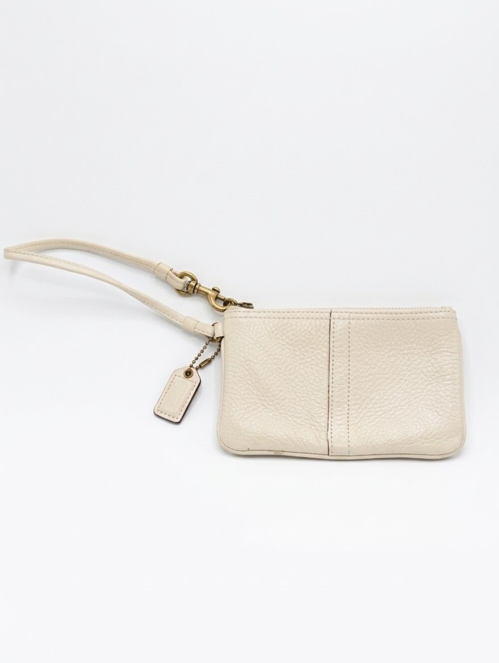 Coach Pebbled Leather Wristlet In Cream